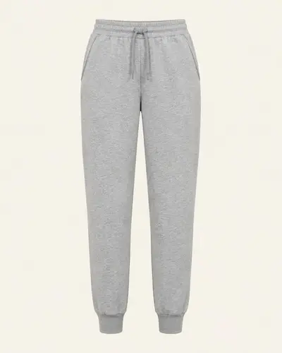 Pantaloni jogger in felpa grigio melange su fondo avorio